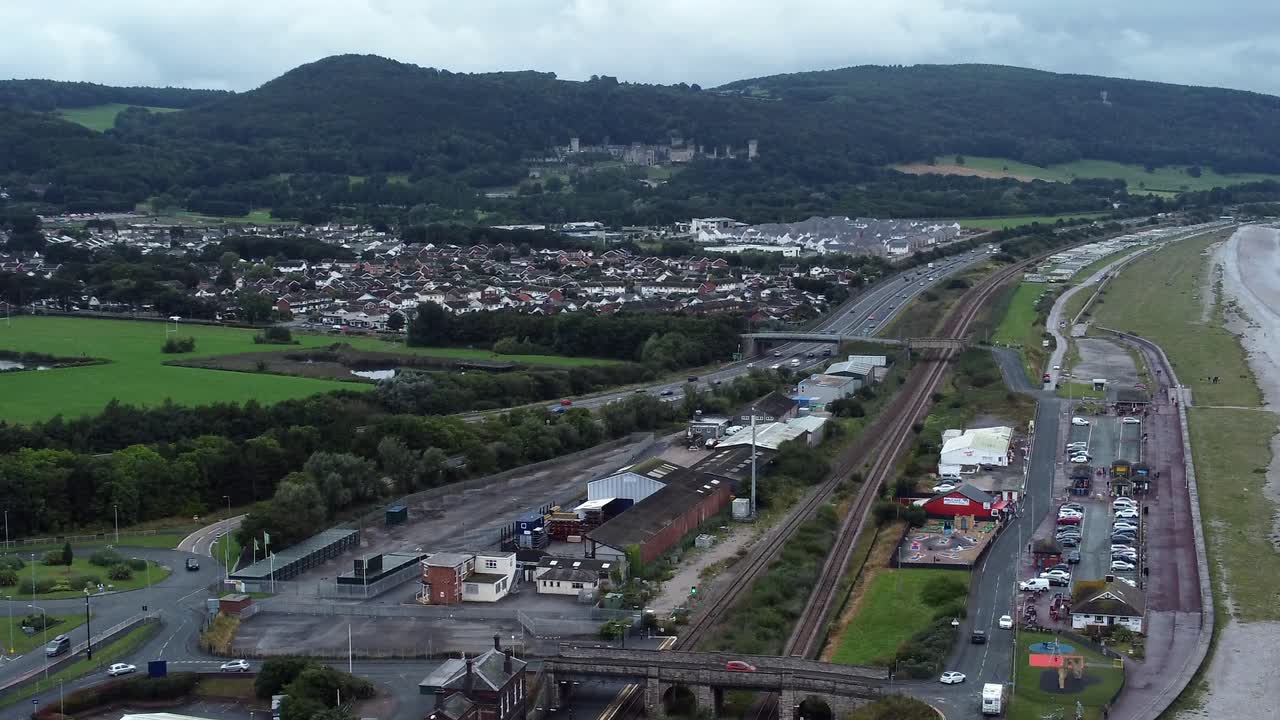 Old Abergele Pensarn seaside town North Wales mountain aerial view zooming in on A55 expressway