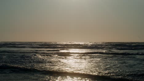 sunset over the ocean waves