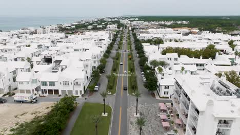 straight up motion over hwy 30a in alys beach fl with active traffic movement and ocean on the background left