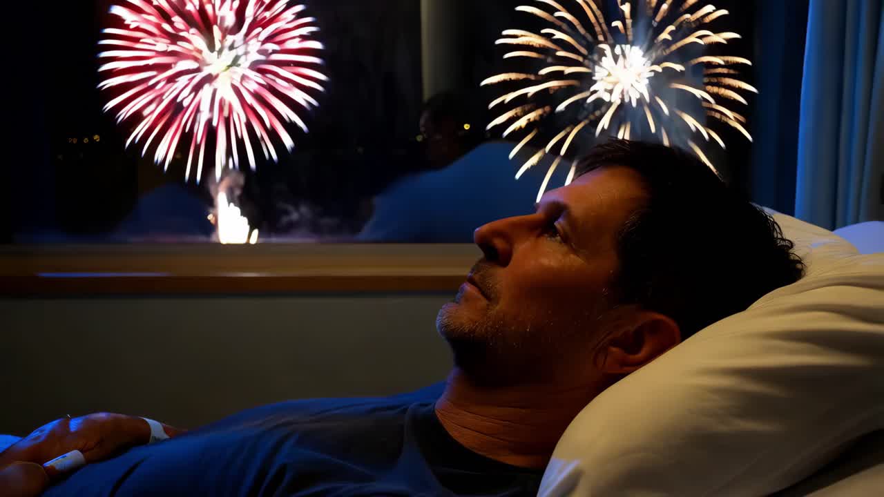 hombre en una cama de hospital viendo fuegos artificiales