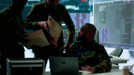 soldiers team analyze real time data collected by surveillance system