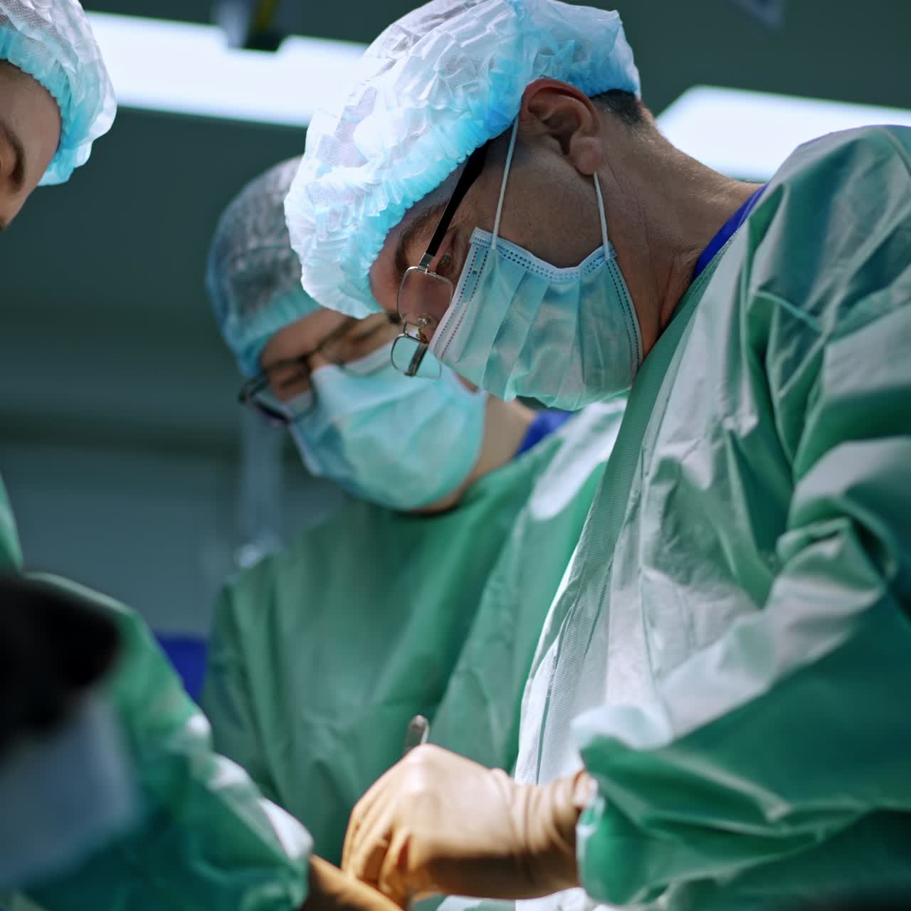 Surgery specialists working in sterile emergency room. Modern operating teamwork