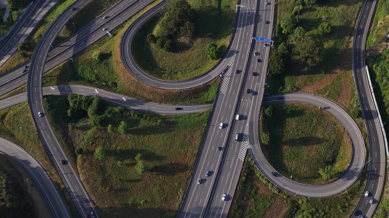 Stunning Drone Shot of Sunset Highway Interchanges with Rush Hour Traffic