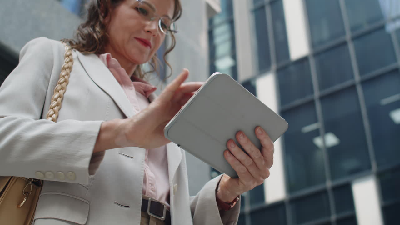 Pensive Female Entrepreneur Using Tablet Computer