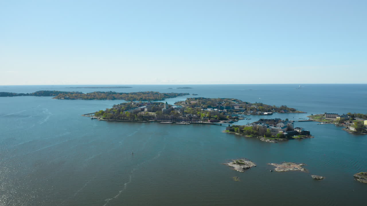 Aerial view of the Suomenlinna fortress island, sunny, spring day, in Helsinki, Uusimaa, Finland - Tracking, drone shot