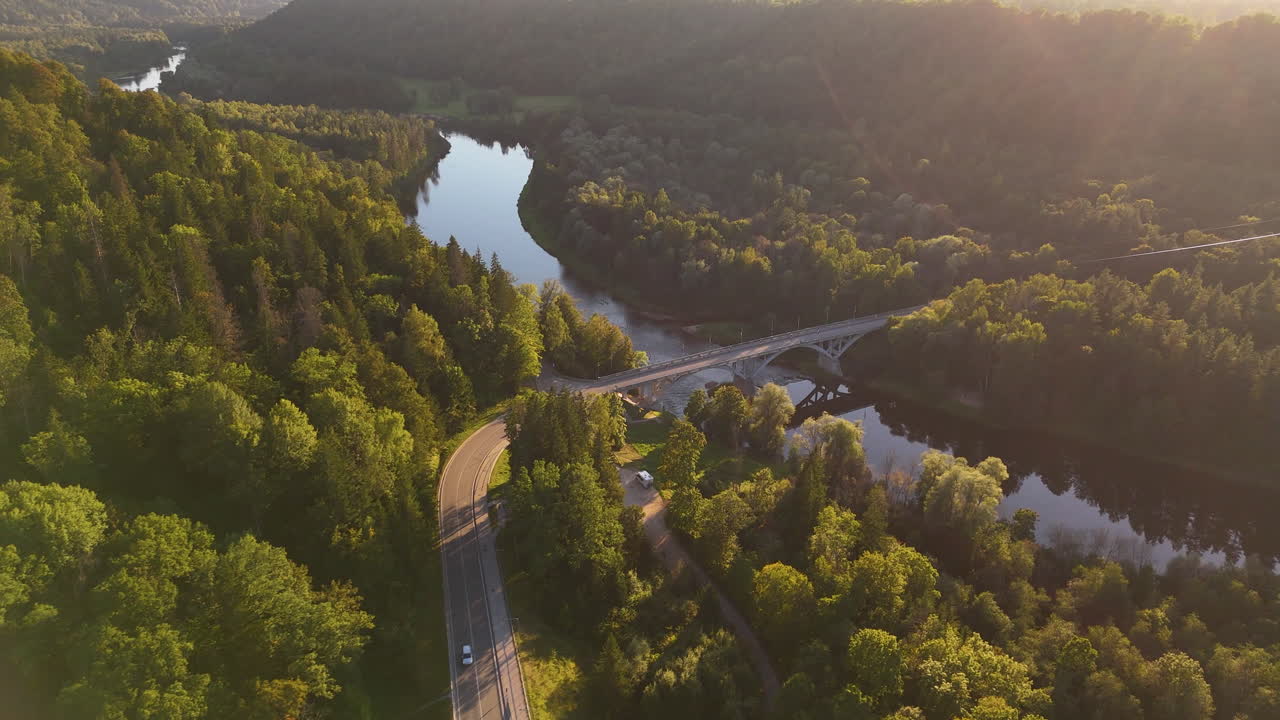 Bridge Over Gauja River In Sigulda, Latvia; 4K Aerial Birds Eye View Over The Scenic Road Surrounded That Leads To Turaida Castle.