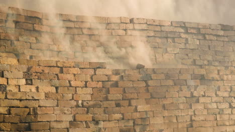 close-up of dangerous gases escaping clay-brick clamp kiln