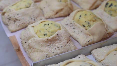 fresh, raw flaouna pastries ready and waiting to be baked