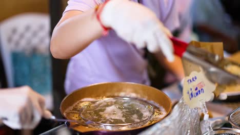 vendor preparing traditional thai desserts in bangkok