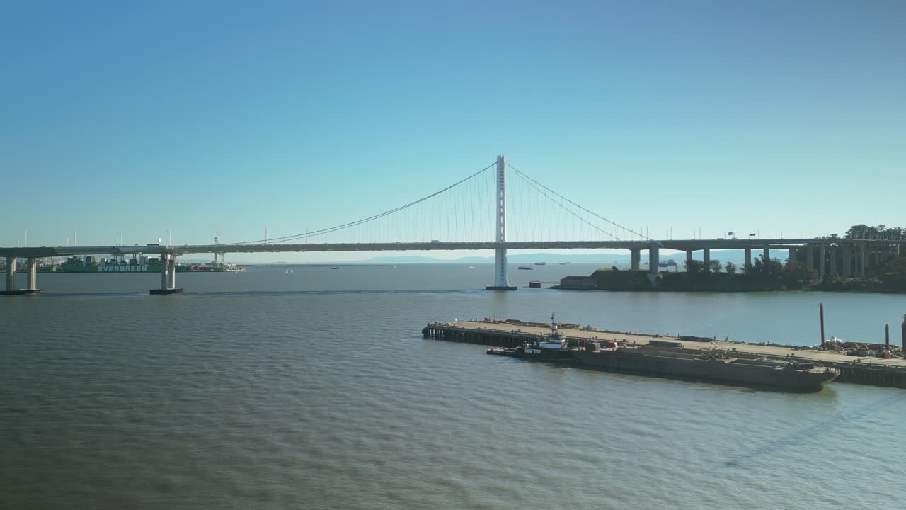 Push in drone shot of San Francisco-Oakland Bay Bridge with sunny weather in California, USA