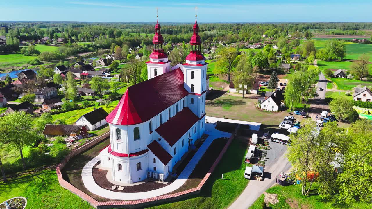 Drone establishing shot of baroque monastery and chapel architecture in Videniškiai, Lithuania