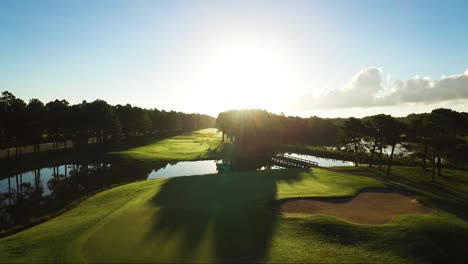 golf course in the morning with green grass and blue skies