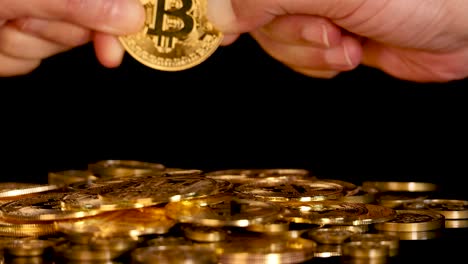 two hands struggle over a gold coin above stacked tokens, dramatic lighting, close-up view