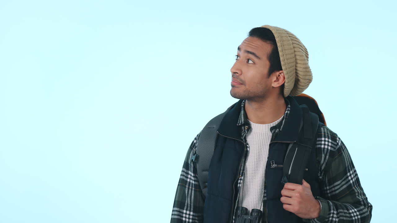 Happy asian man, backpack and pointing with OK