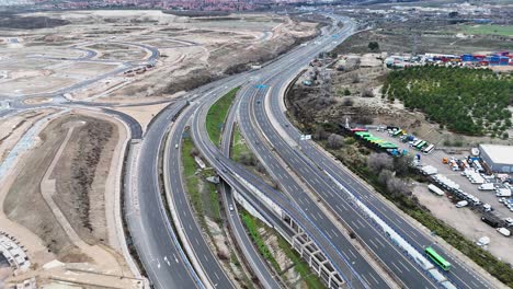 highway in madrid spain splitting into lanes drone view
