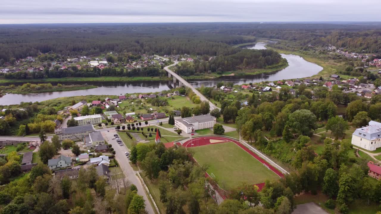 Aerial view of Kraslava, Latvia with Kraslava Bridge over the River Daugava and sports area