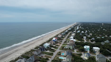 Drone-shot-of-beach-homes-and-ocean