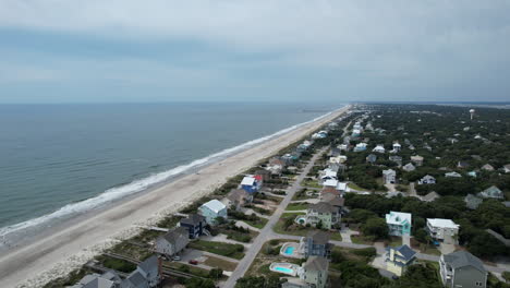 drone shot of beach homes and ocean