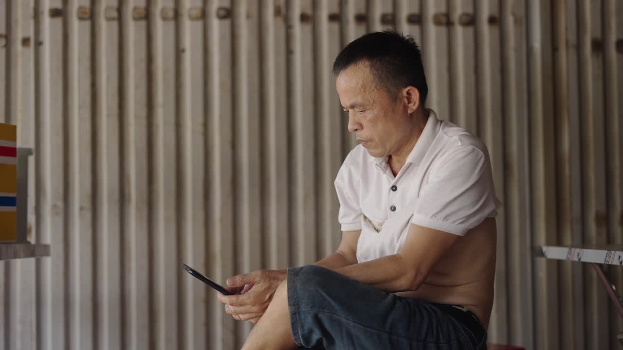 Older Man Using Mobile Phone