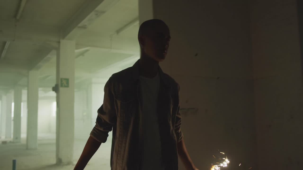 Fashionable young man in an abandoned warehouse