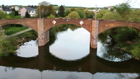 beautiful drone flight over the bavarian countryside with old bridge footage