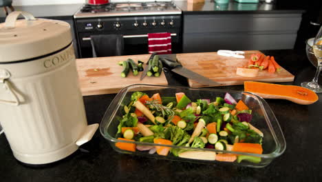 preparing fresh vegetables in modern kitchen with wine and olive oil, at home