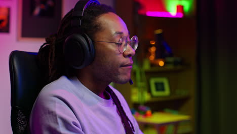 man playing video games in his home studio