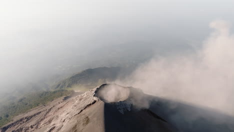 Aerial:-Slow-orbit-of-active-Fuego-volcano-crater-In-Guatemala