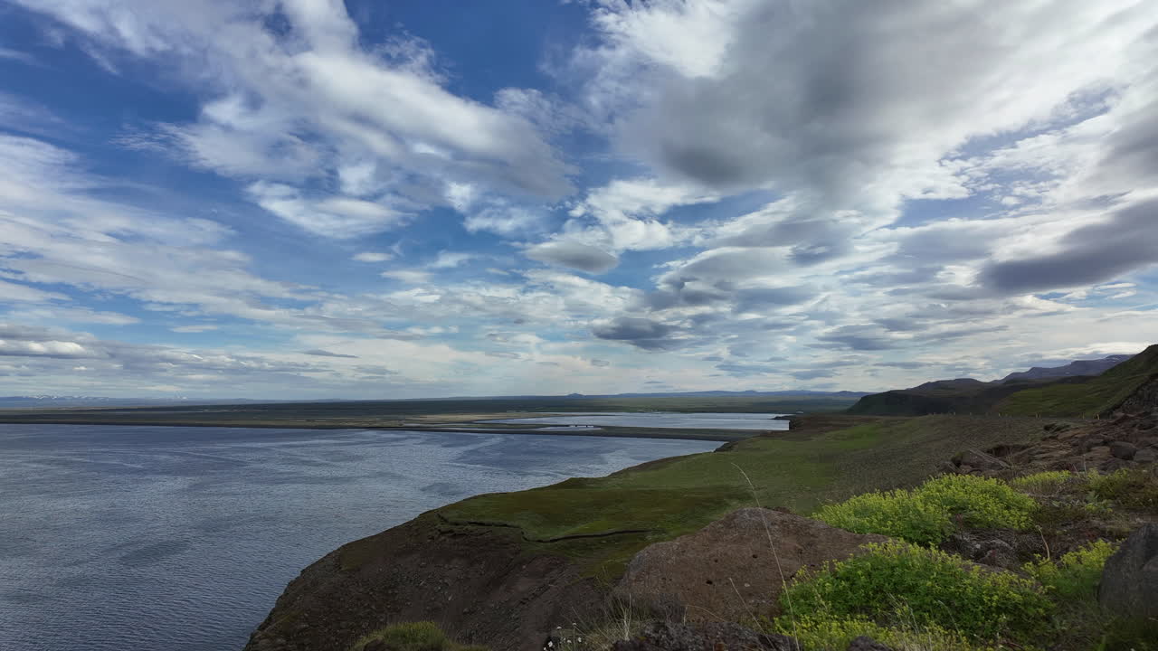 Timelapse footage showing clouds flowing past a dramatic cliff formation near Húsavík in northern Iceland