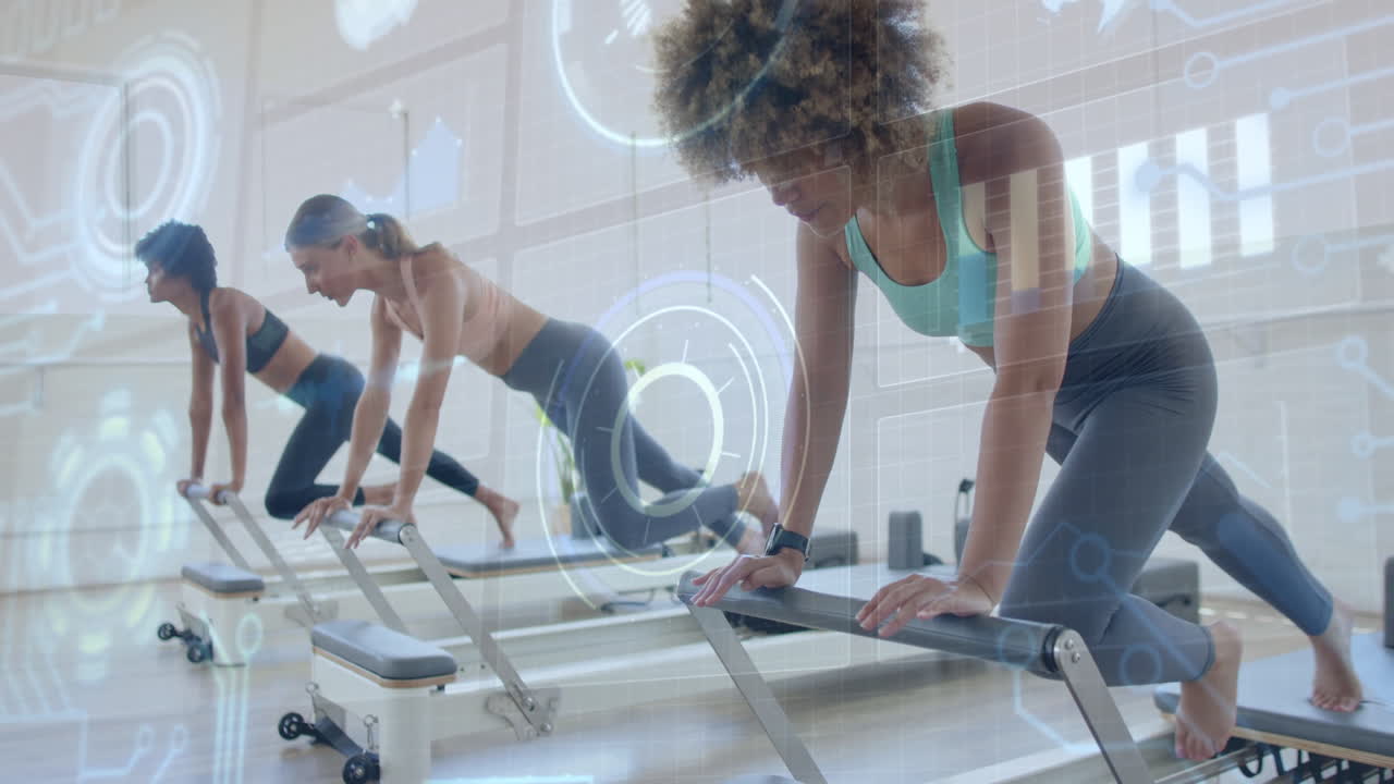 Women exercising on reformer machines with digital data overlay animation