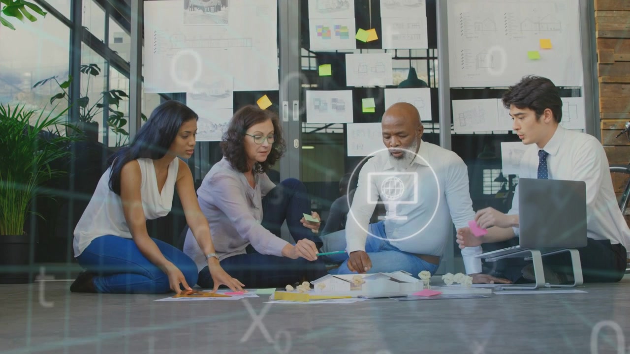Four colleagues reviewing glass charts, sorting post-its for design while UI overlay animating