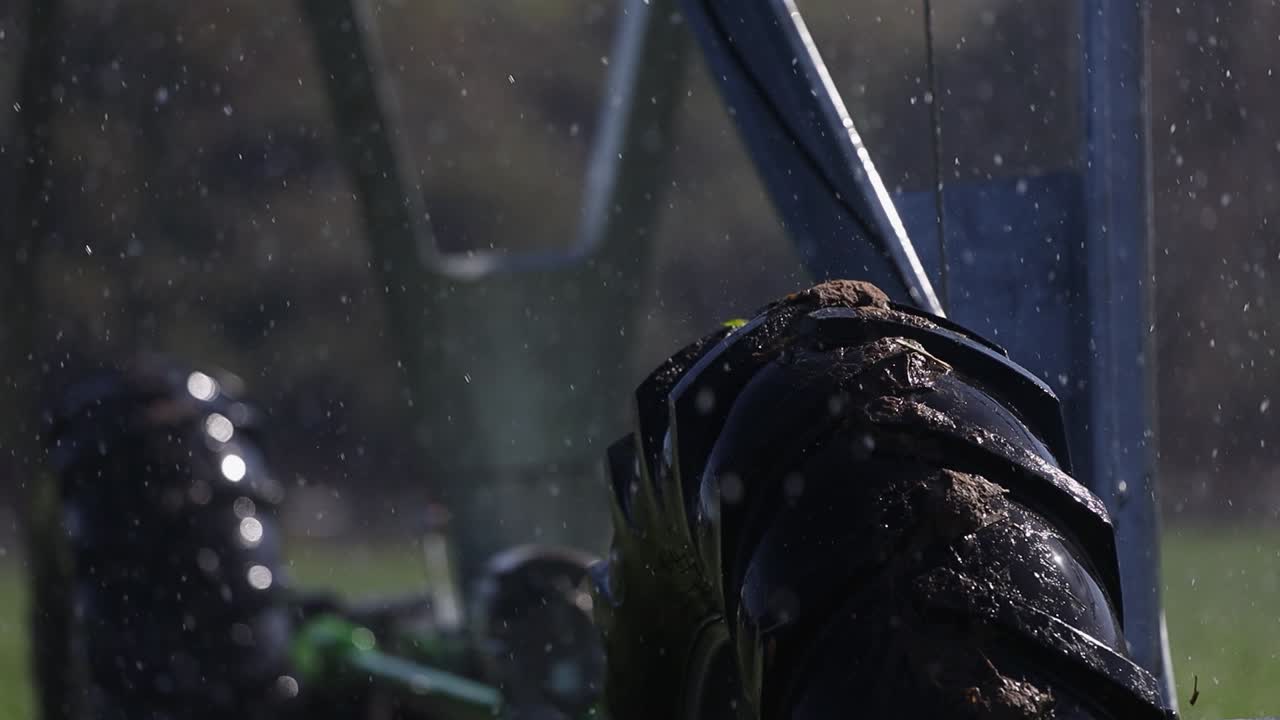 Water spray droplets as wheels of irritation pivot roll across crop
