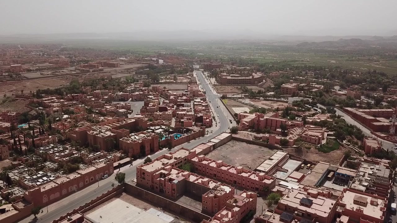 Drone aerial view of Ouarzazate, showcasing its distinctive desert cityscape, cultural identity, and role as a leading tourism destination in southern Morocco.
