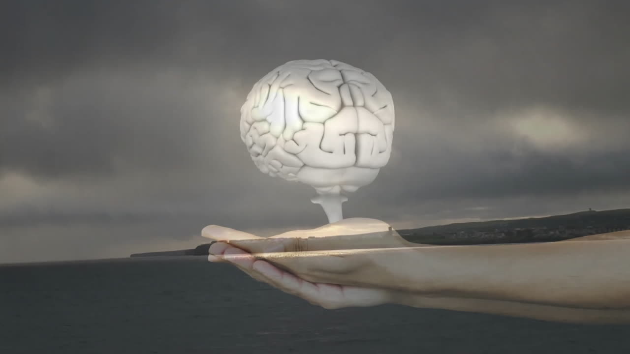 Holding floating brain over stormy ocean, hand creating animation effect