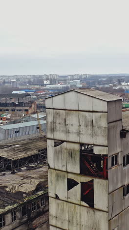 ruins of an old factory. old industrial building for demolition. aerial view vertical video