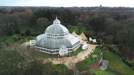 sefton park palm house liverpool victorian exotic conservatory greenhouse aerial botanical landmark dome building slow left orbit