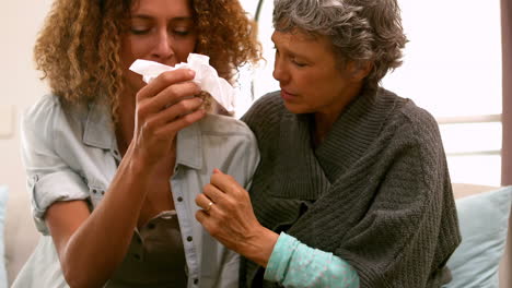 woman taking care of her sad friend