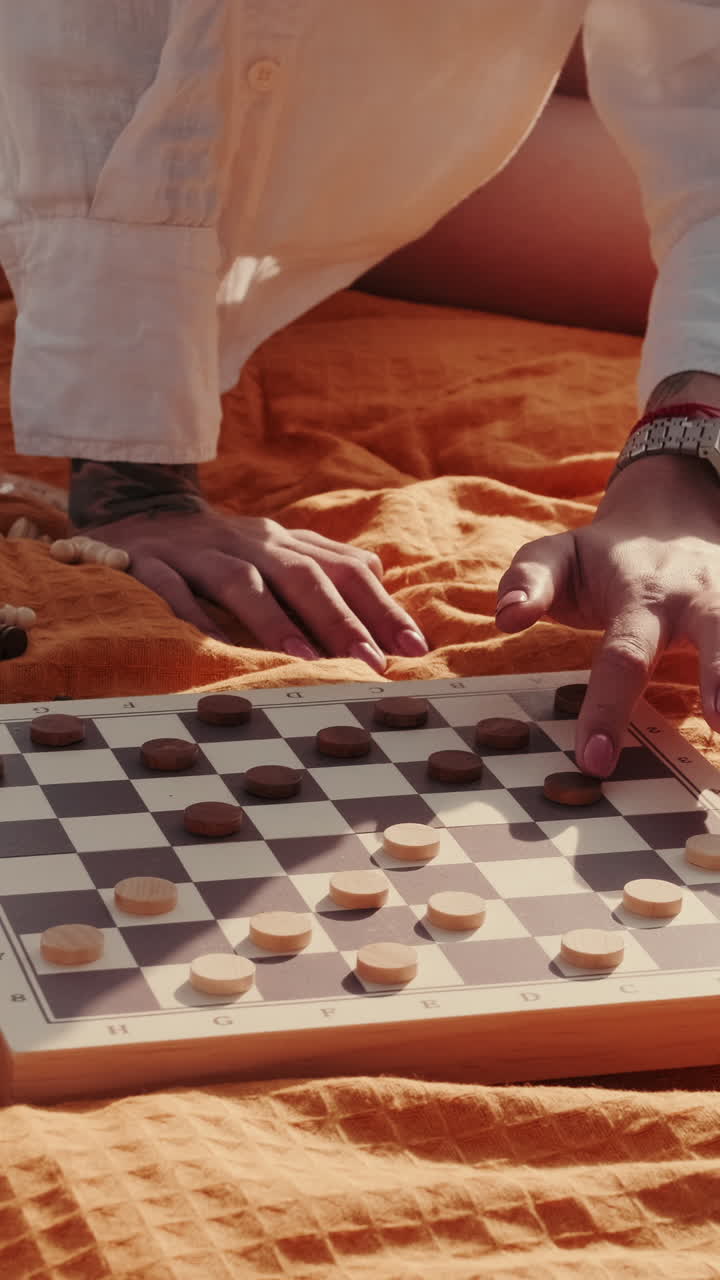 Friends Playing Checkers at a Picnic