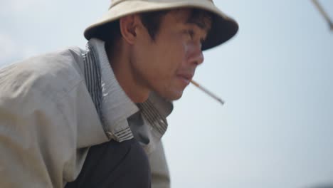man smoking cigarette outdoors