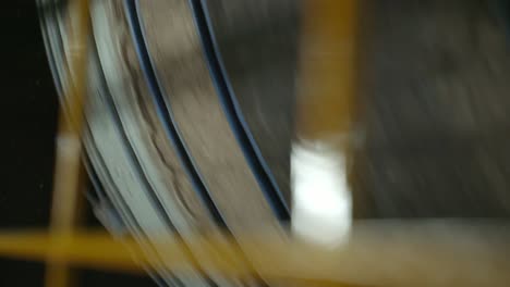 closeup of a wood drum rotating, industrial drying machine