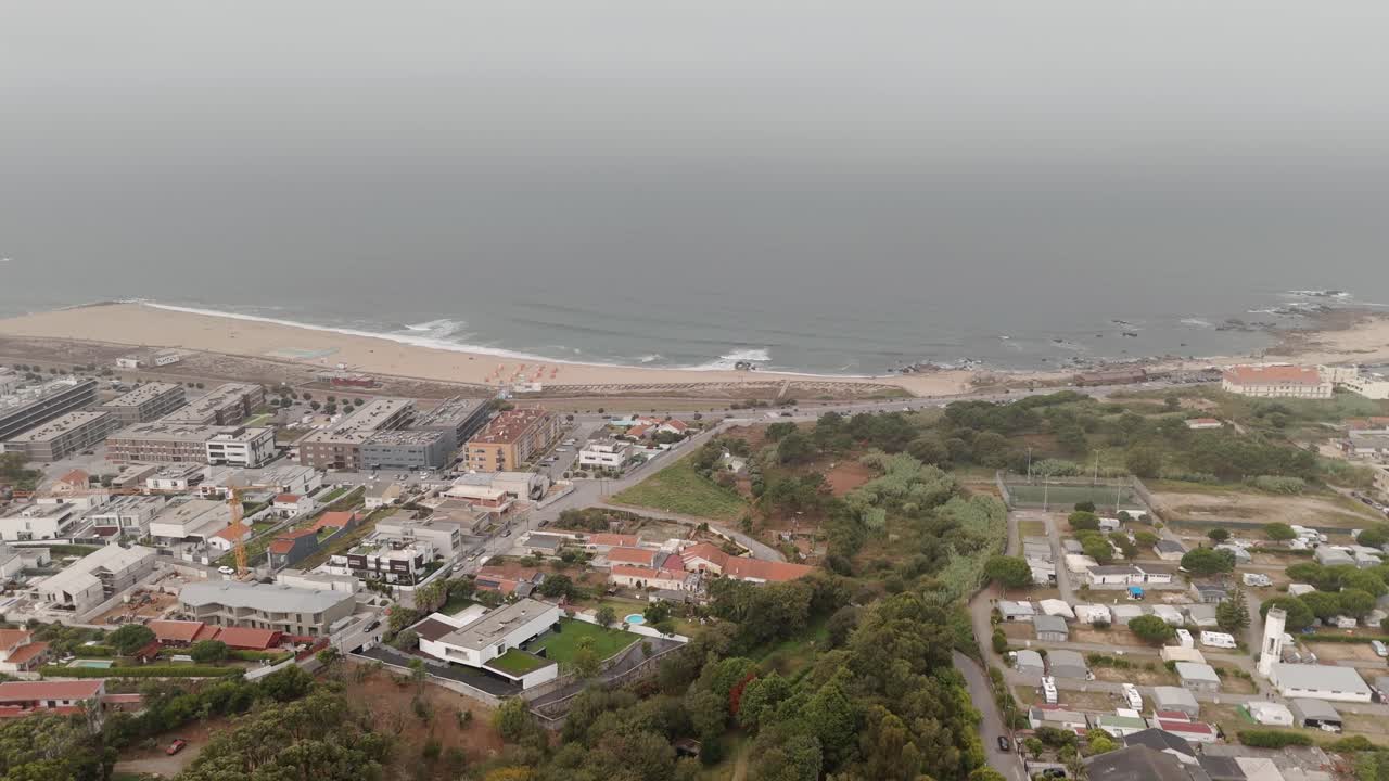 Aerial - view of Sereia Beach, buildings, and coastline in Vila Nova de Gaia, Portugal