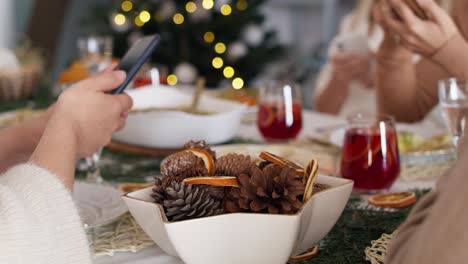 family spending christmas eve with mobile phones