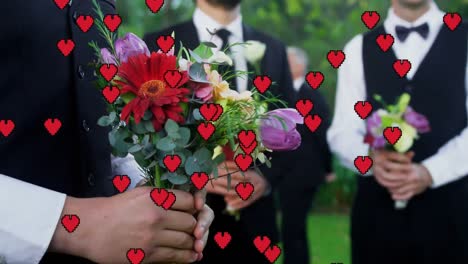 Animation-of-red-hearts-over-caucasian-groom-getting-married-holding-flowers