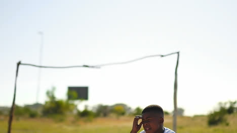 Thoughtful-boy-sitting-in-the-ground-4k