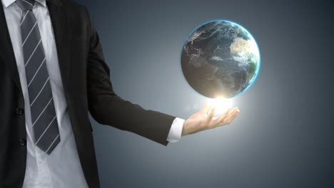 Businessman-holding-digital-generated-globe