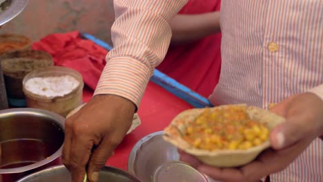 man making the papdi chaat recipe closeup view