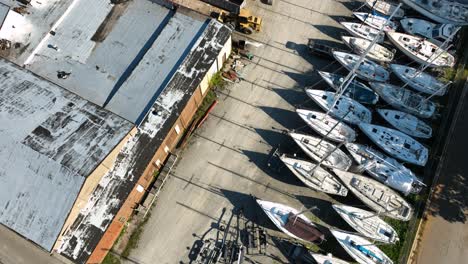 aerial twisting motion over retired sailboats