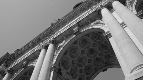 Low-angle-and-close-up-Arcade-du-Cinquantenaire-in-Brussels-Belgium-in-black-and-white