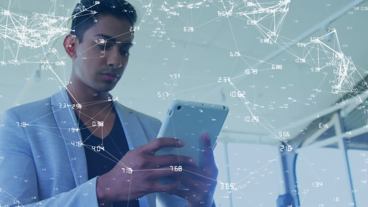 Animation of network of connections over asian businessman using digital tablet at office