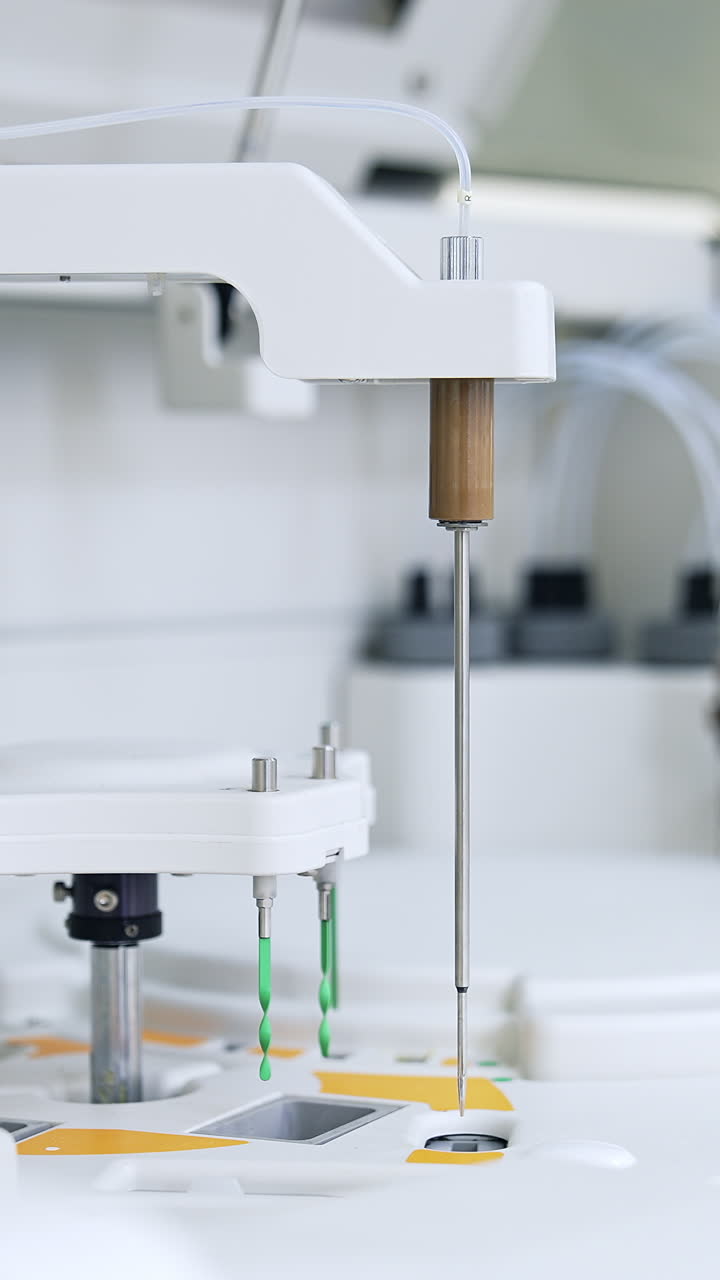 Some parts of modern equipment moving and carrying the blood test. Advanced technological appliances for science test and analysis. Vertical video